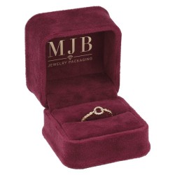Open burgundy velvet jewellery box CHA1S-BU holding a stone-set ring, gold MJB logo inside the lid
