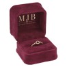 Open burgundy velvet jewellery box CHA1S-BU holding a stone-set ring, gold MJB logo inside the lid