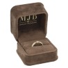 Open brown velvet jewellery box CHA1S-M holding a stone-set ring, gold MJB logo inside the lid