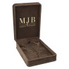 Open brown velvet jewellery box CHA5C-M holding a necklace with its pendant, gold MJB logo inside the lid